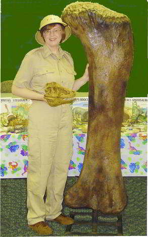 Library Visit Janet Riehecky with dinosaur femur